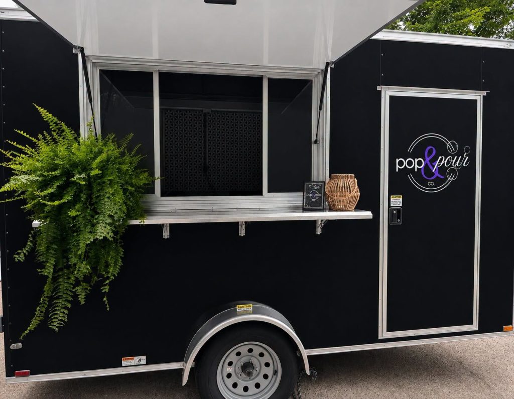 Pop & Pour Co. mobile bar trailer by Shuckers, ready to serve at an event in St. Albans, WV