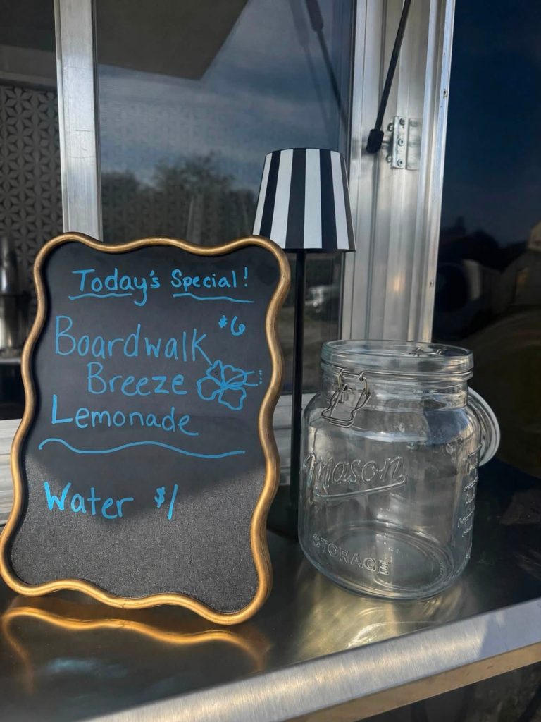 Today’s Specials board and a sample Mason jar drink on the Pop & Pour Co. bar counter